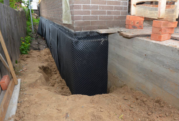 SJ Waterproofing Pros technician performing targeted Exterior Waterproofing assessment in Steele, AL